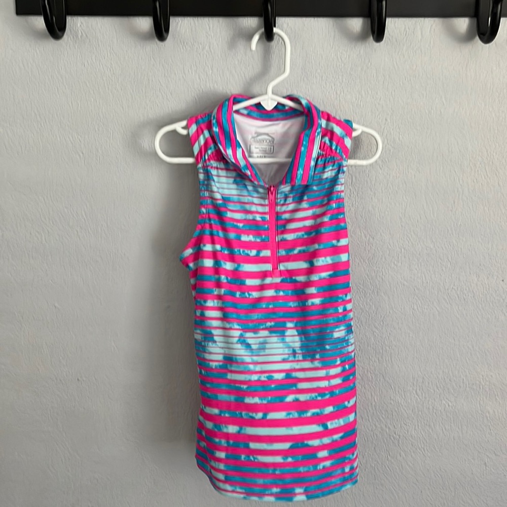 A gently used sleeveless girls golf shirt!